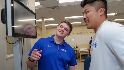 a student works with a patient at a clinic